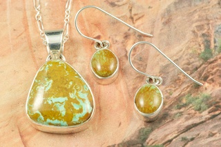 Genuine Crow Springs Turquoise set in Sterling Silver. Beautiful Pendant and Earring Set. Created by Navajo Artists Bobby Piaso and Berna Francisco. Signed by the artists. The Crow Springs Mine is located near Tonopah, Nevada. Free 18